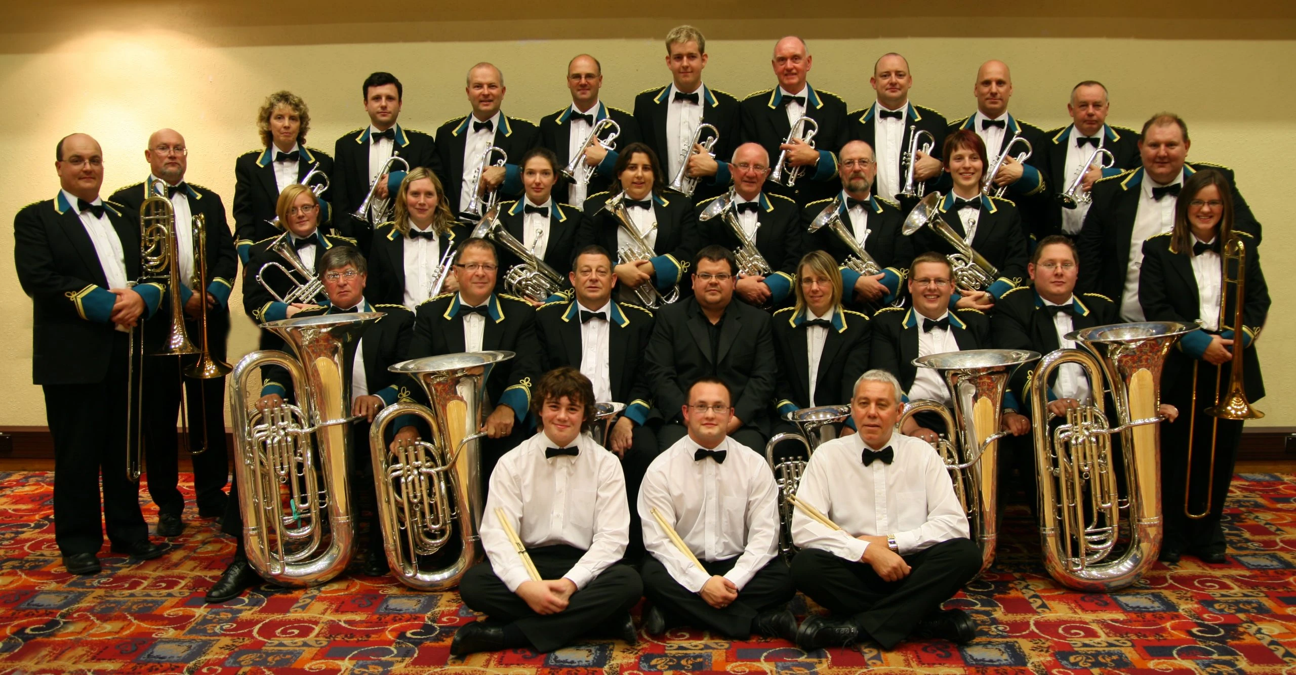 Emley Brass Band posed together with brass instruments in September 2009.